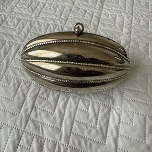 Silver studded hard shell clutch